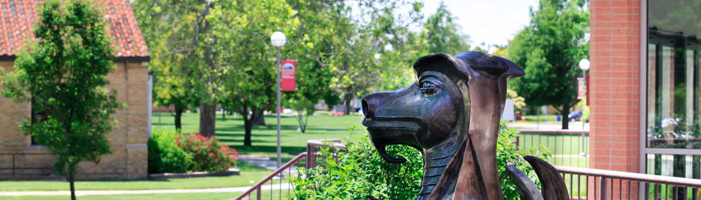 The HutchCC dragon statue in front of Lockman Hall