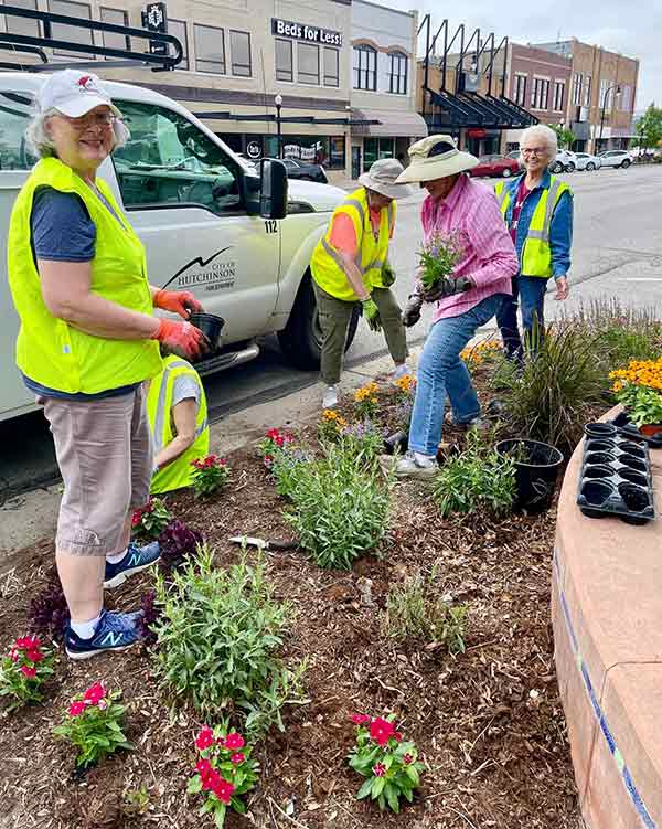 Volunteers for HutchCC planting flowers